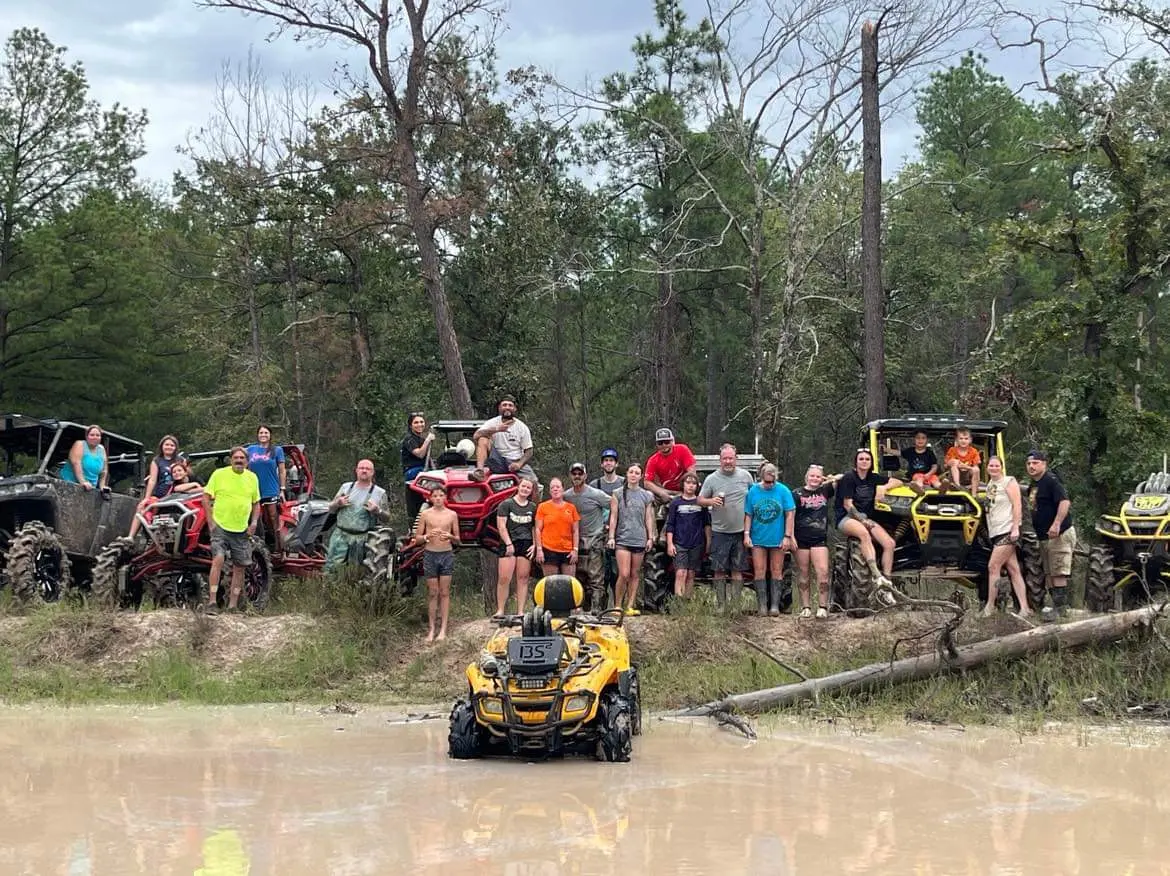 A group of off-road riders gathered with their machines