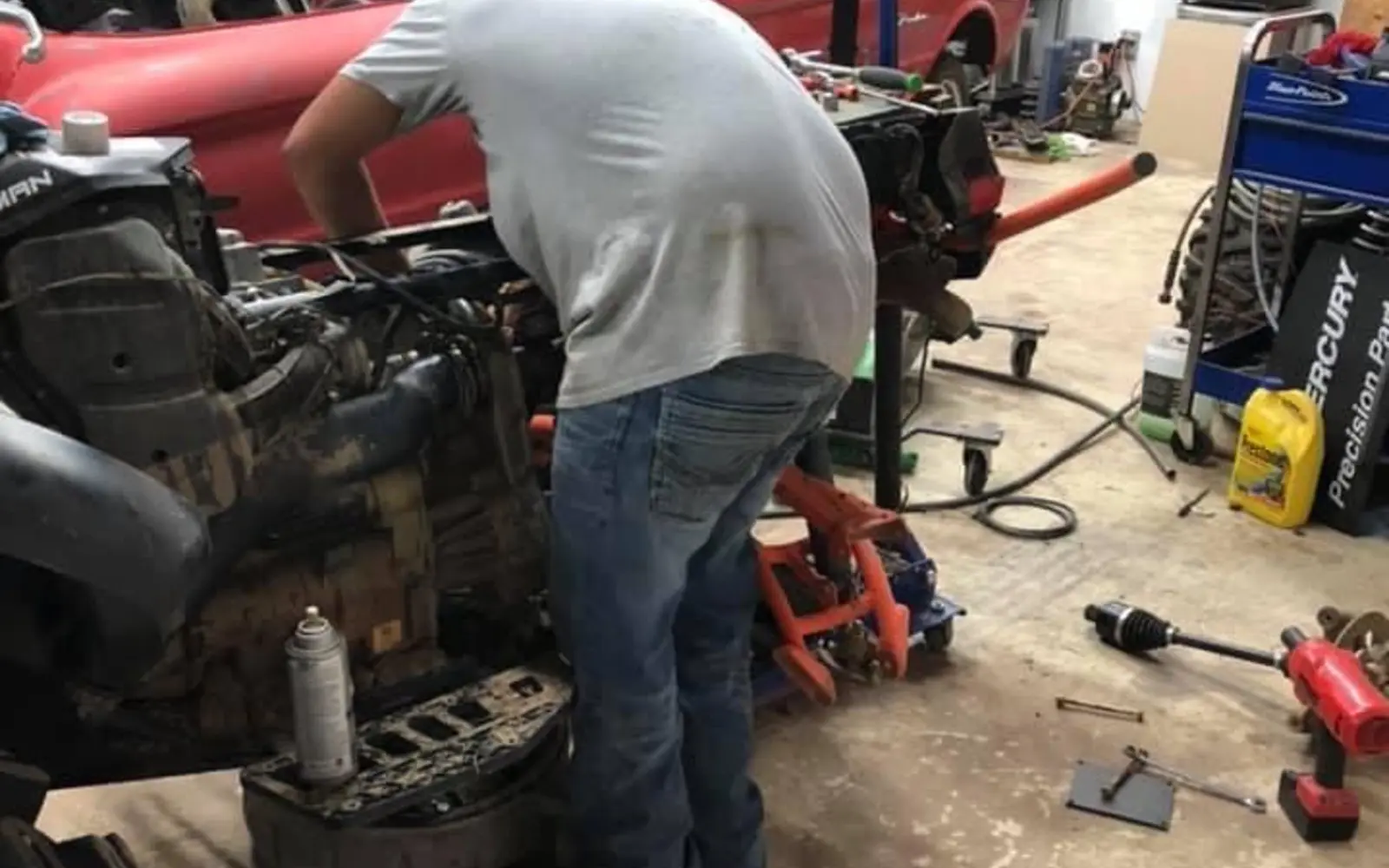 Off-road machine being worked on in a real repair bay